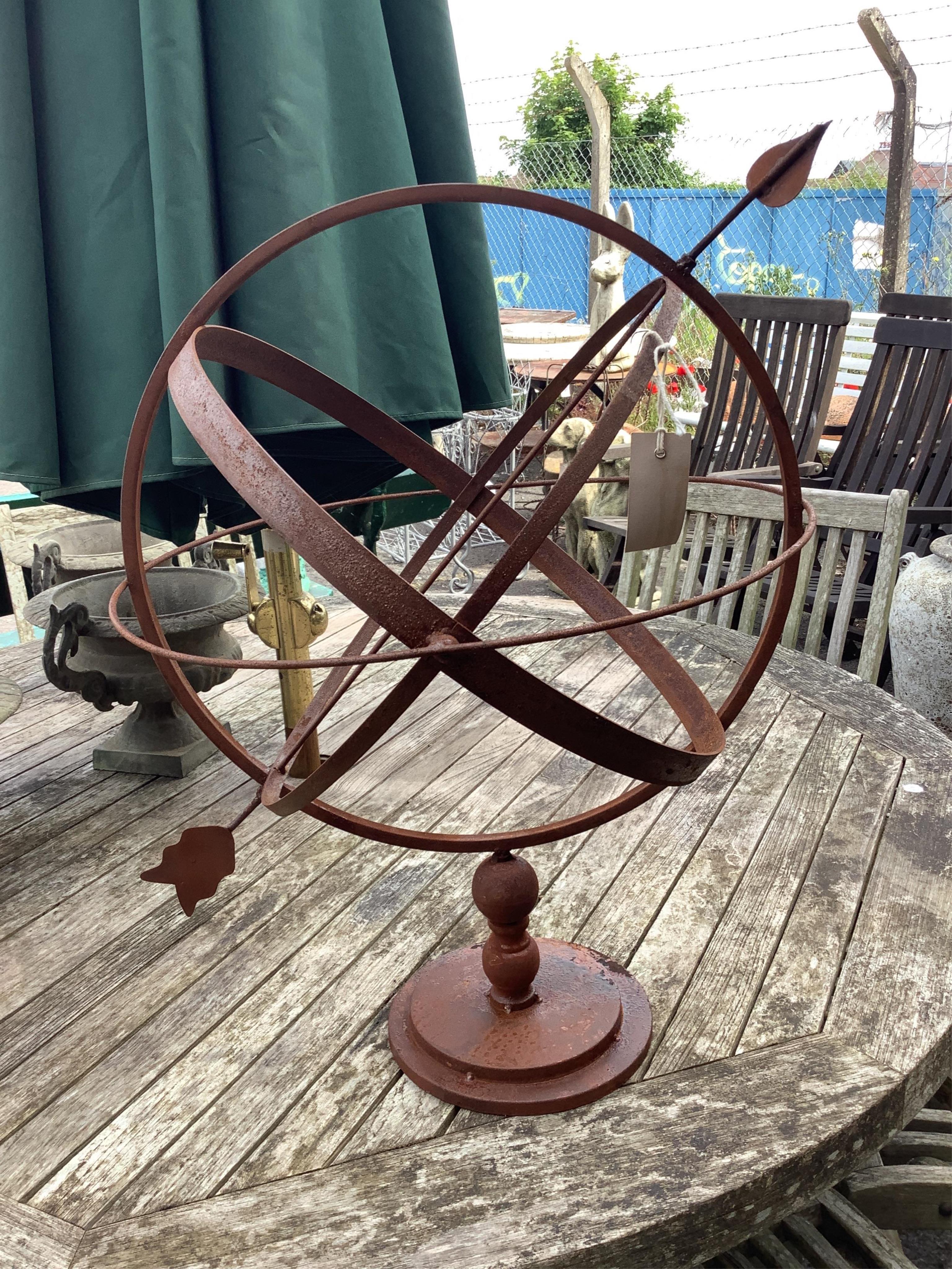 A metal armillary sphere, height 62cm. Condition - fair